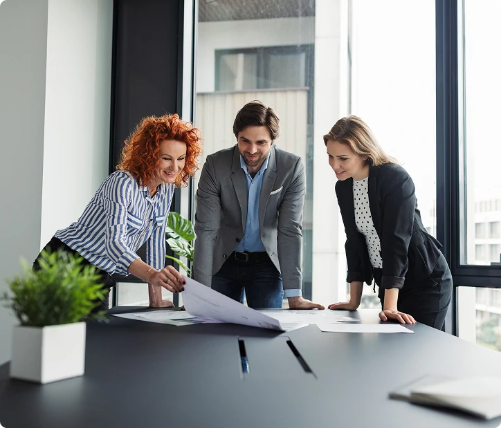 business owners reviewing clear financial report with fractional CFO business owners reviewing clear financial report with fractional CFO